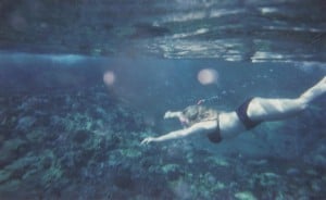 Intuitive Psychic Medium in Florida swimming with orbs in the ocean